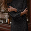 Mini vestido de fiesta de lentejuelas con mangas abullonadas negro